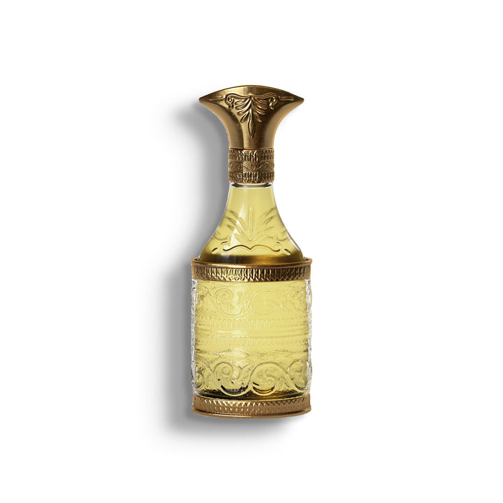 AMOUAGE CRISTAL & GOLD ANNIVERSARY EDITION MAN single perfume bottle on pure white with a soft left-down tabletop shadow
